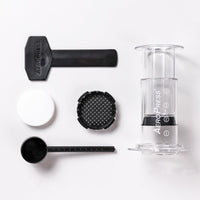 AeroPress® Clear - Kaffeezubereiter Set - Inkl. 100 Filter & Dosierlöffel
